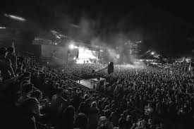 Timeless black-and-white photo of a euphoric concert crowd – raw energy of live music in monochrome. GloboAlert Entertainment.
