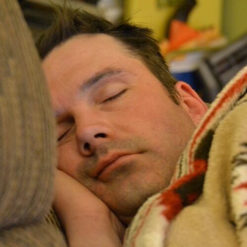 The silent passage into conscious dreaming is symbolized by a man in deep sleep who may be approaching the REM stage, which is when lucid dreams are most likely to happen.