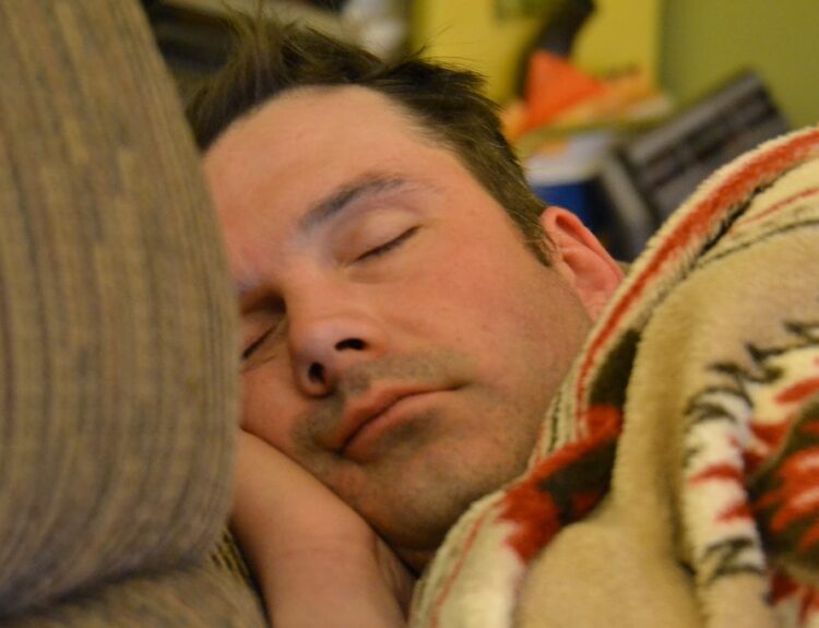 The silent passage into conscious dreaming is symbolized by a man in deep sleep who may be approaching the REM stage, which is when lucid dreams are most likely to happen.