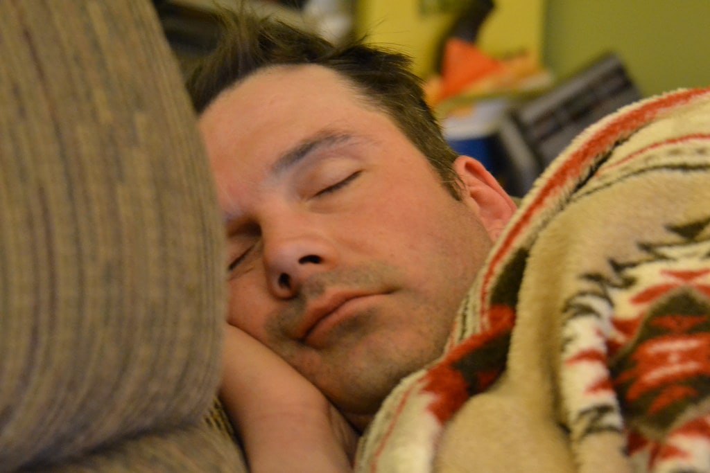 The silent passage into conscious dreaming is symbolized by a man in deep sleep who may be approaching the REM stage, which is when lucid dreams are most likely to happen.